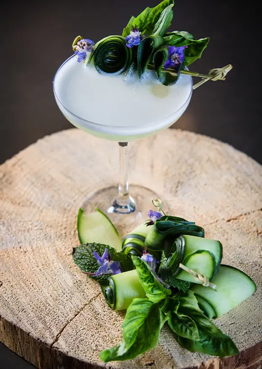gene autry cocktail with cucumber garnish at the peel