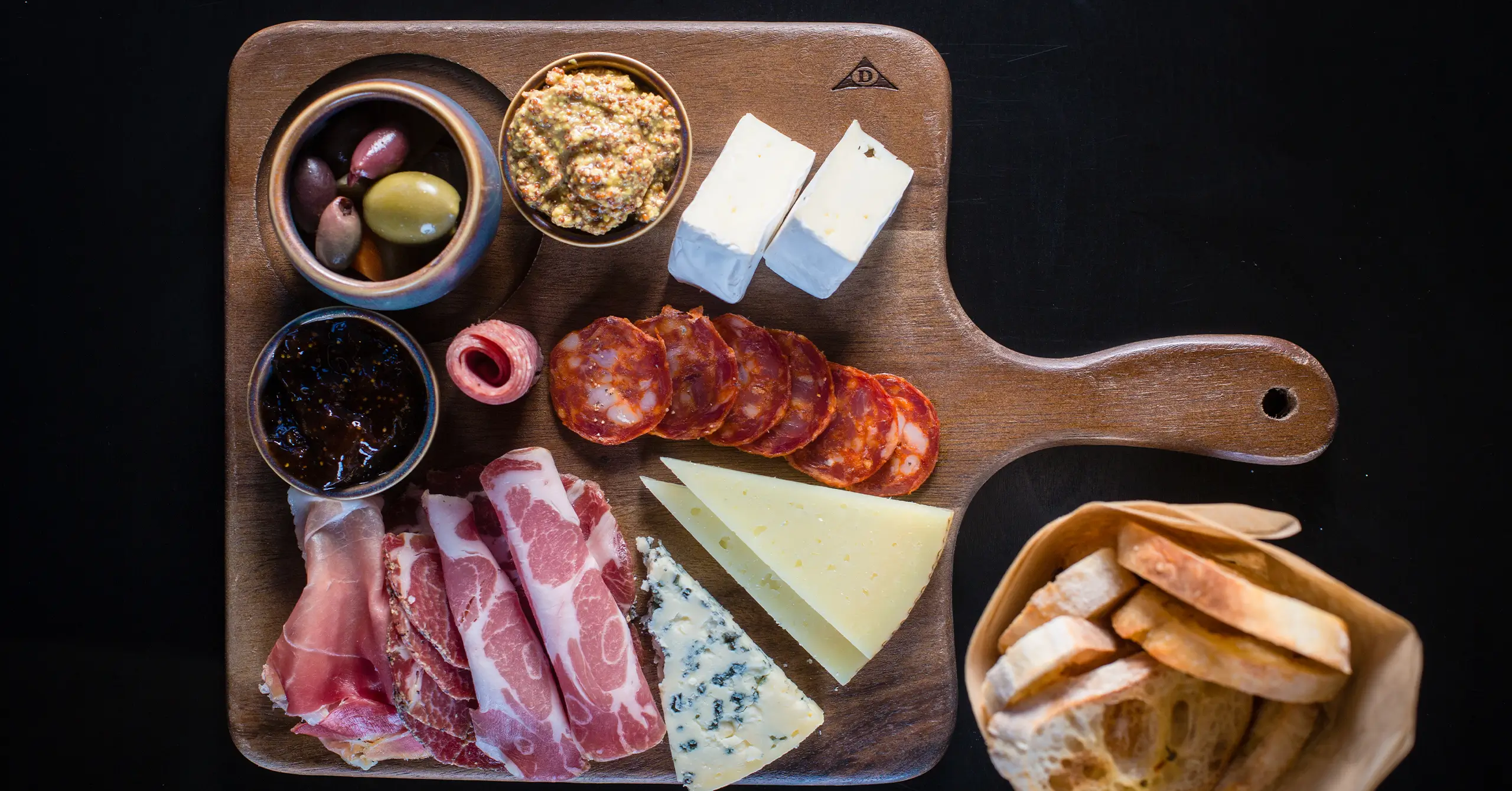 overhead view of charcuterie board at the peel craft bar