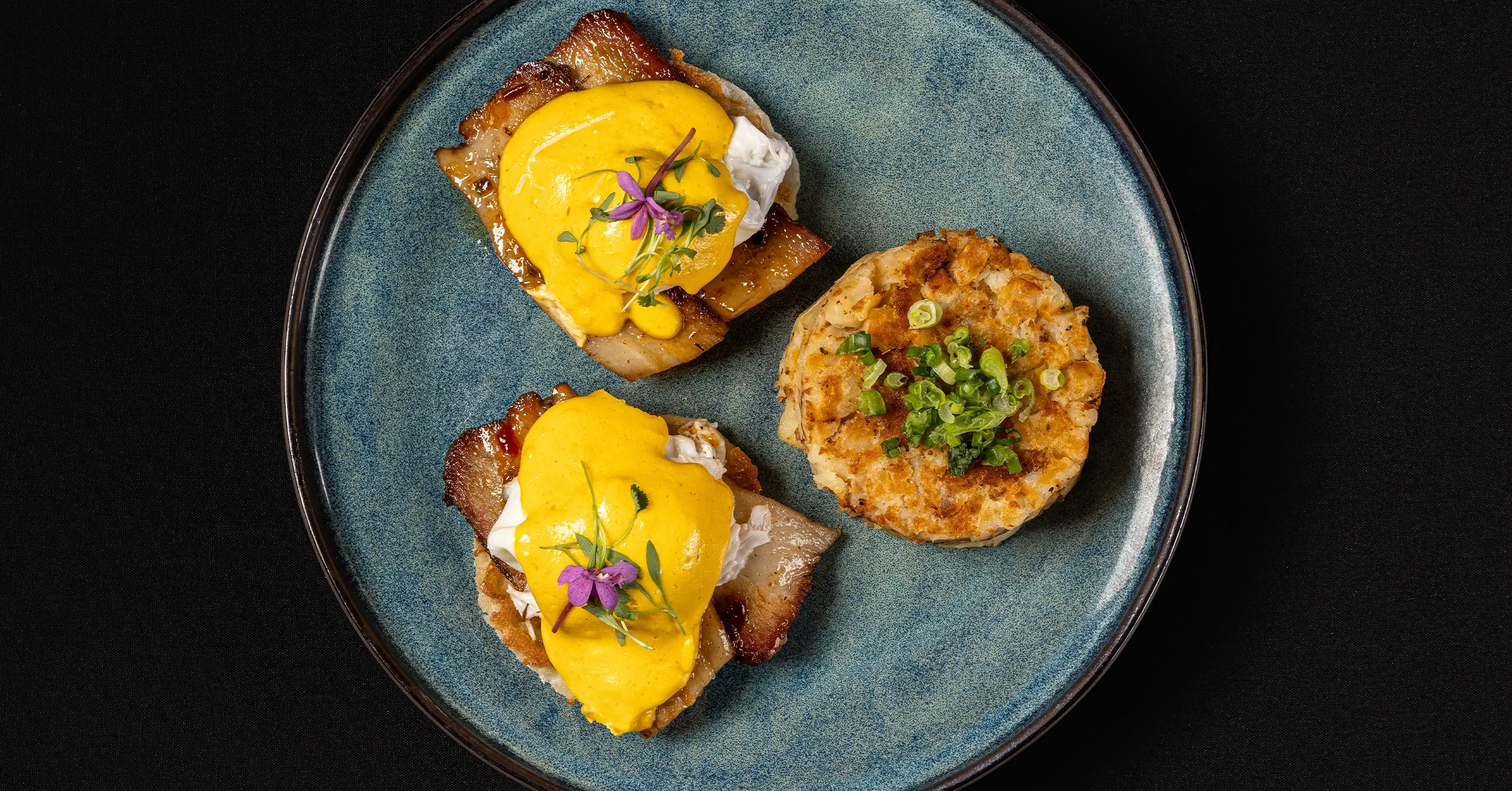 eggs benedict with breakfast potatoes