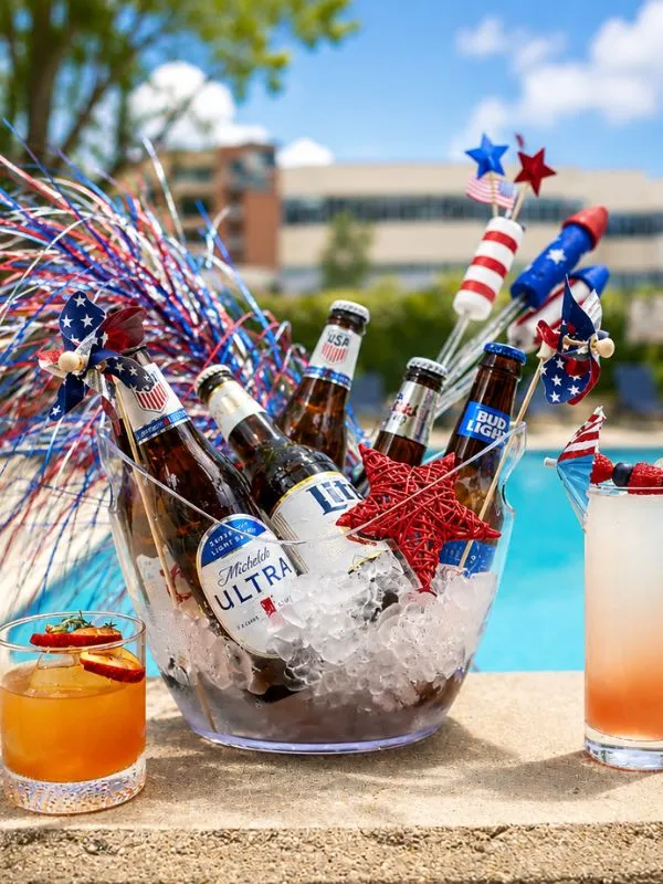 beer bottles in a glass bowl with patriotic decorations